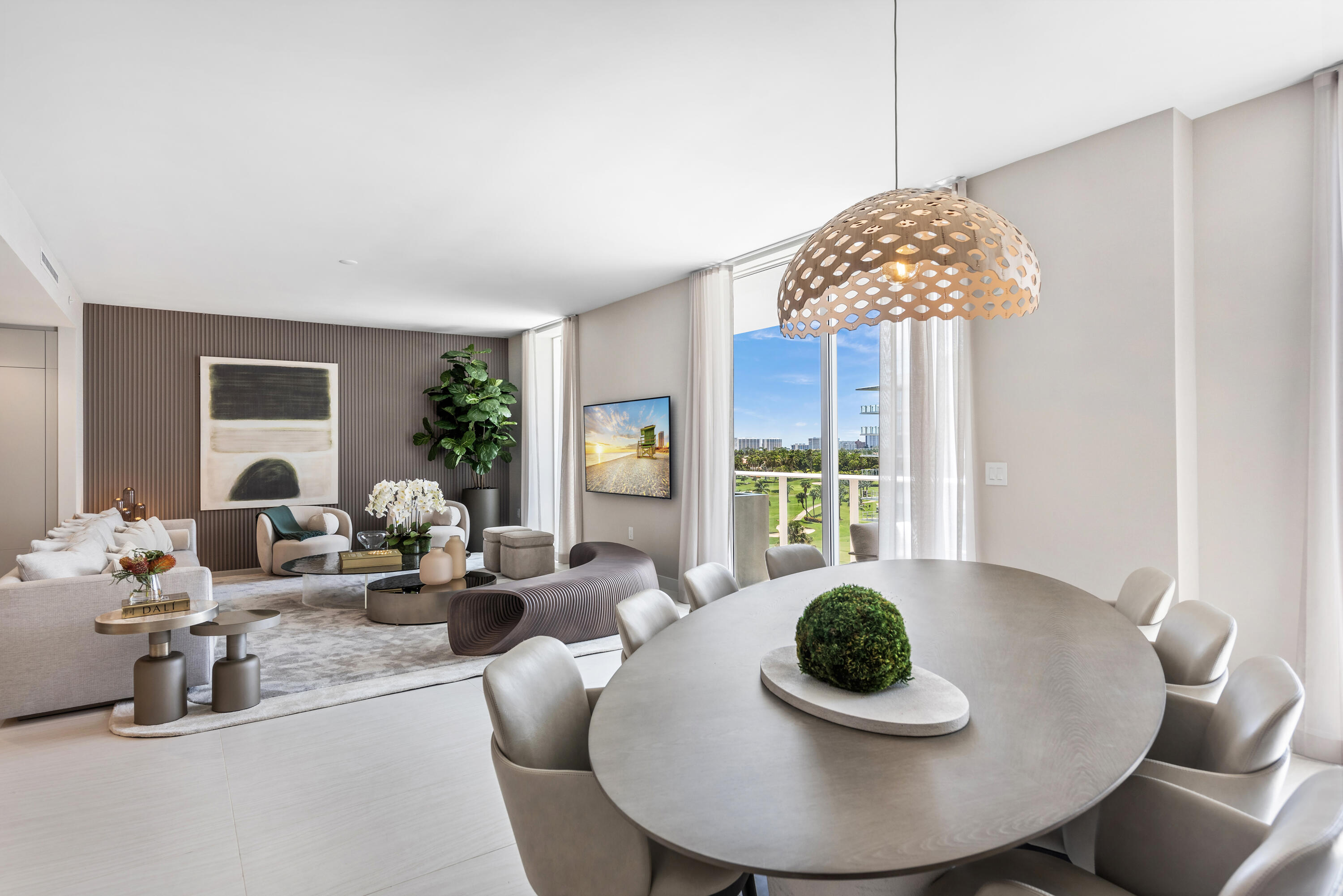 210 Southeast Mizner Boulevard, Unit 604 Boca Raton, FL 33432 - Photo 1 of 19 a living room with furniture and a potted plant
