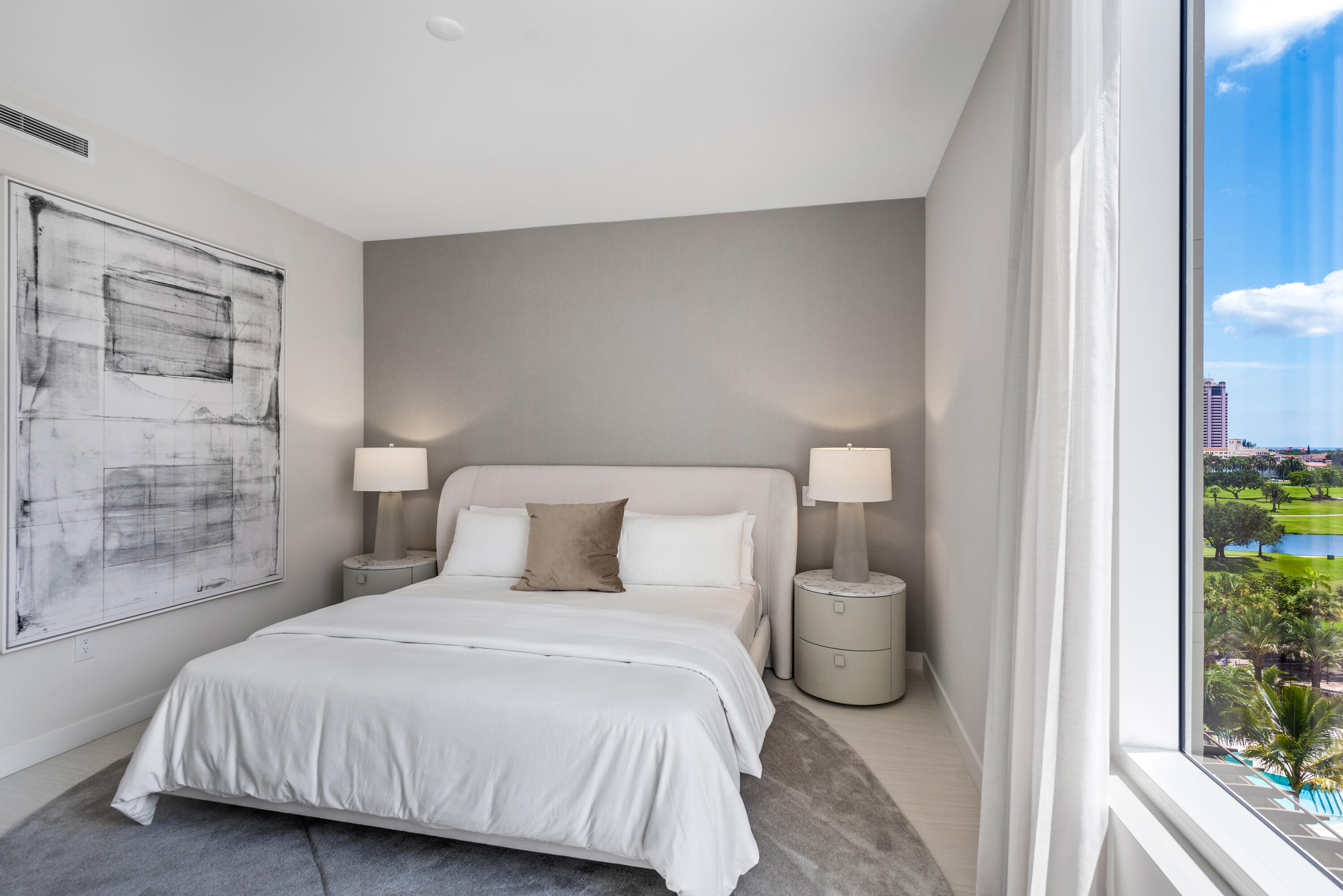 210 Southeast Mizner Boulevard, Unit 604 Boca Raton, FL 33432 - Photo 13 of 19 a bedroom with a bed and a window