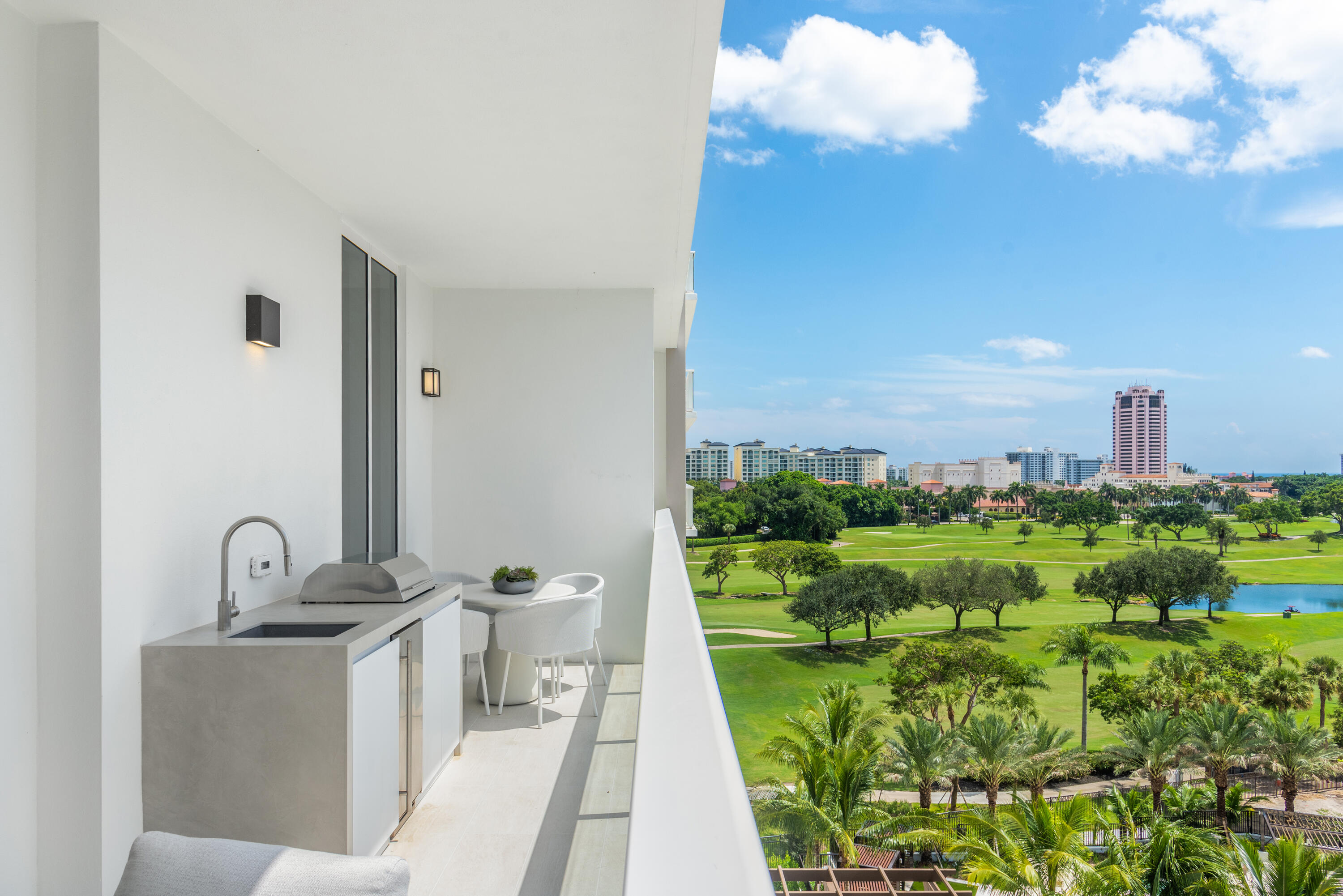 210 Southeast Mizner Boulevard, Unit 604 Boca Raton, FL 33432 - Photo 14 of 19 a front view of a house with a yard