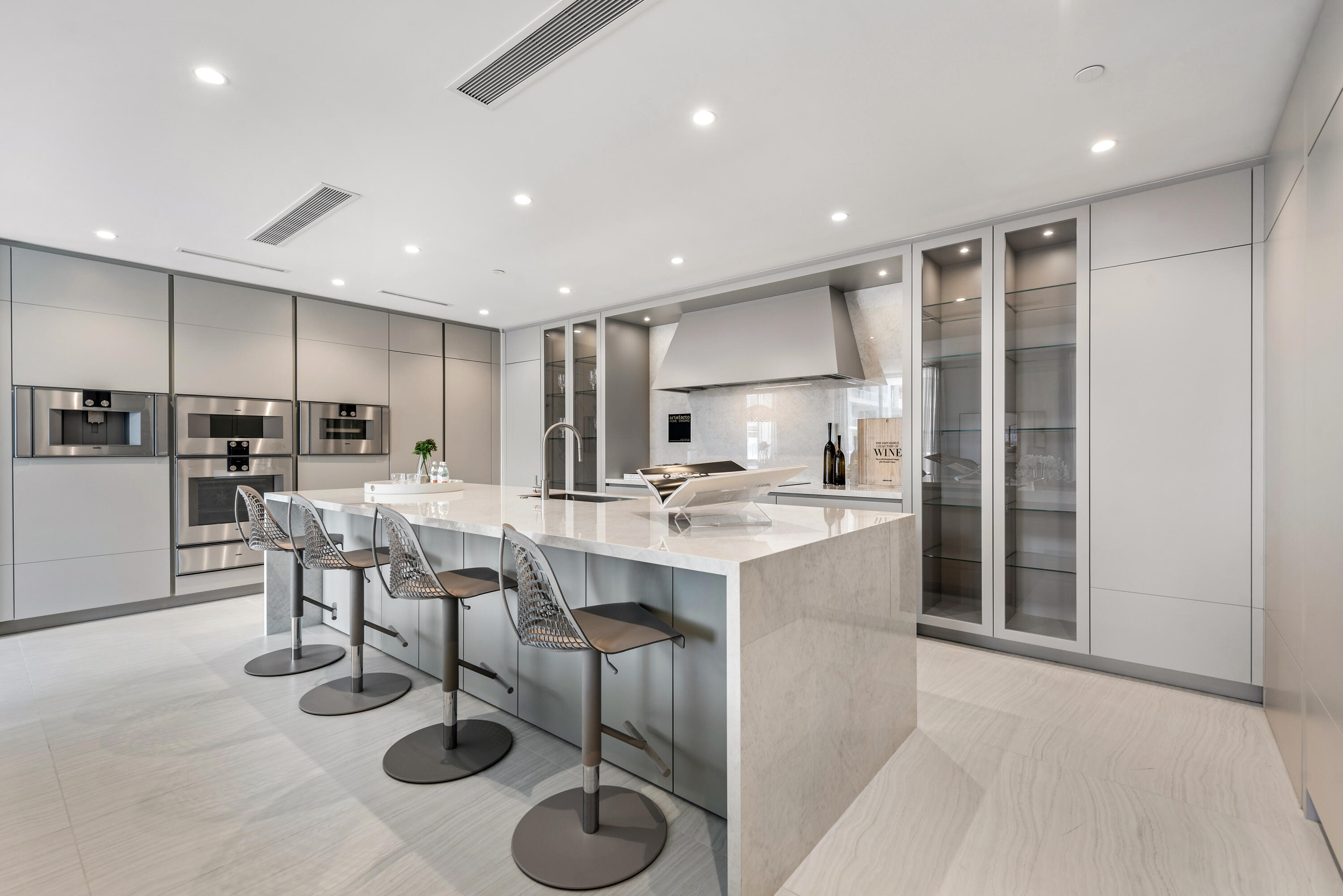 210 Southeast Mizner Boulevard, Unit 604 Boca Raton, FL 33432 - Photo 6 of 19 a kitchen with a sink cabinets and counter space