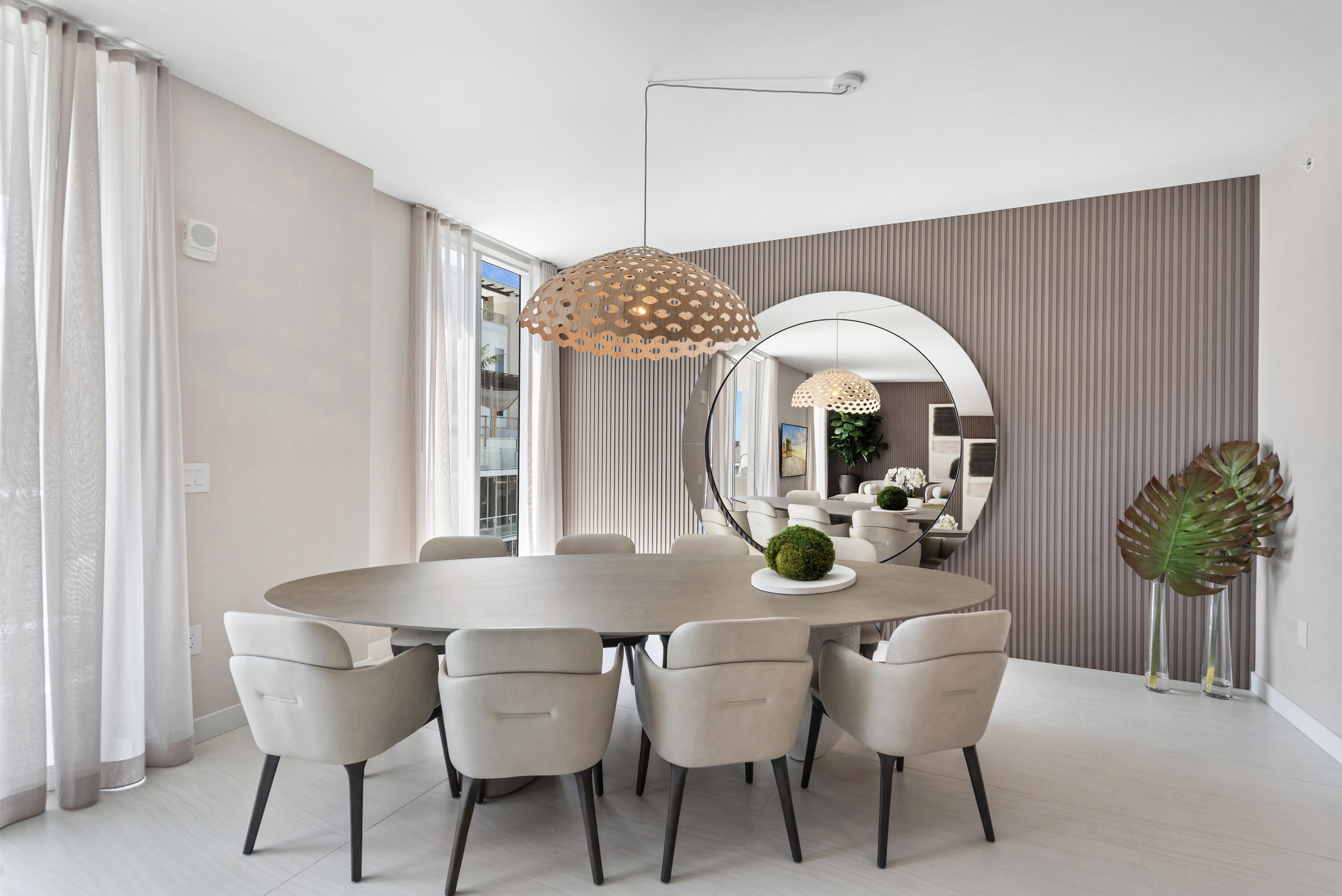 210 Southeast Mizner Boulevard, Unit 604 Boca Raton, FL 33432 - Photo 7 of 19 a view of a dining room with furniture and chandelier