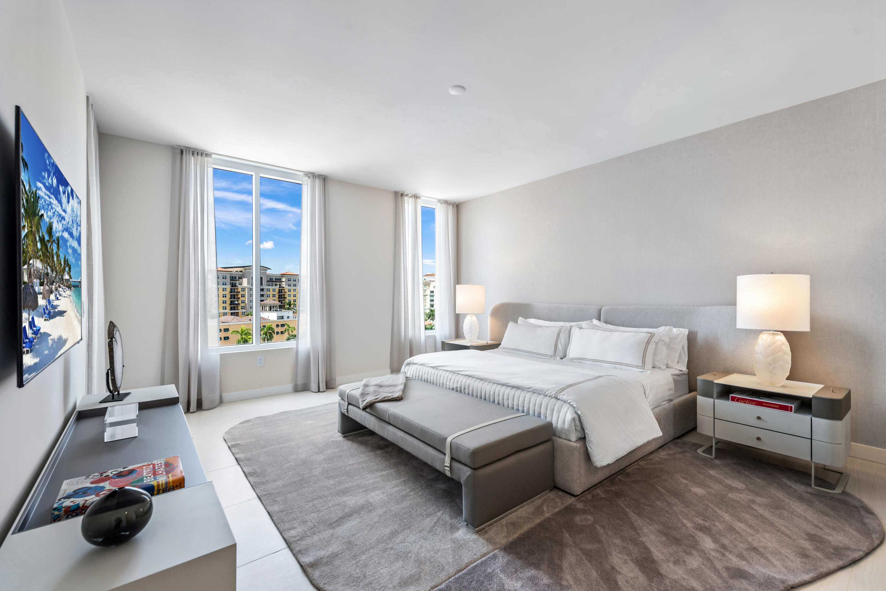 210 Southeast Mizner Boulevard, Unit 604 Boca Raton, FL 33432 - Photo 8 of 19 a spacious bedroom with a bed and a couch