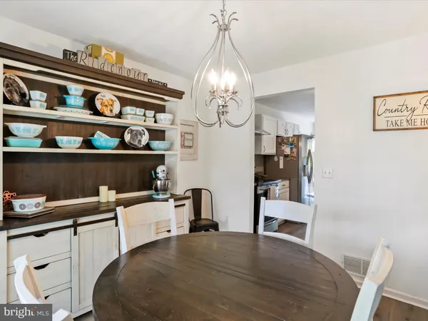 a kitchen with a refrigerator stove and cabinets