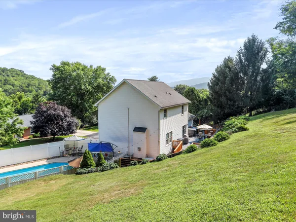 a view of a swimming pool with a patio