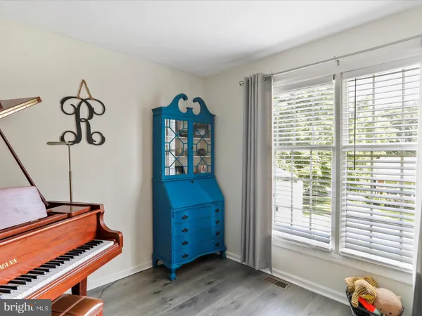 a room with furniture and wooden floor