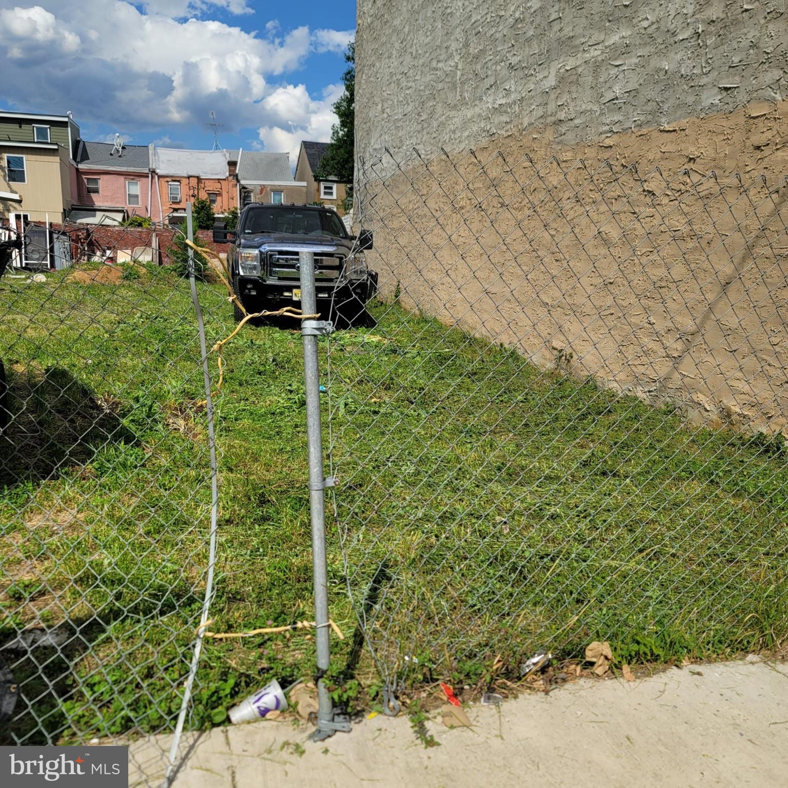 1821 Orthodox Street Philadelphia, PA 19124 - Photo 1 of 5 a backyard of a house with lots of green space