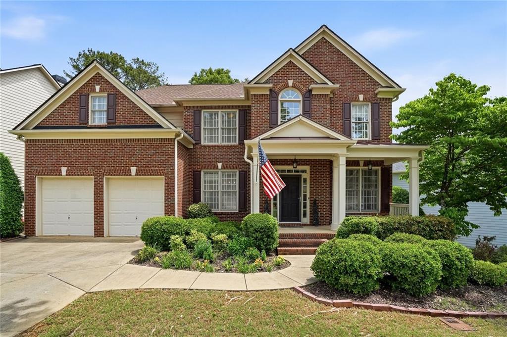855 Freedom Way Cumming, GA 30040 - Photo 1 of 25 front view of a house with a yard
