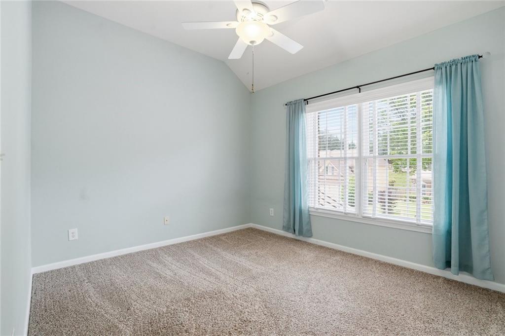 855 Freedom Way Cumming, GA 30040 - Photo 12 of 25 a view of an empty room with a window