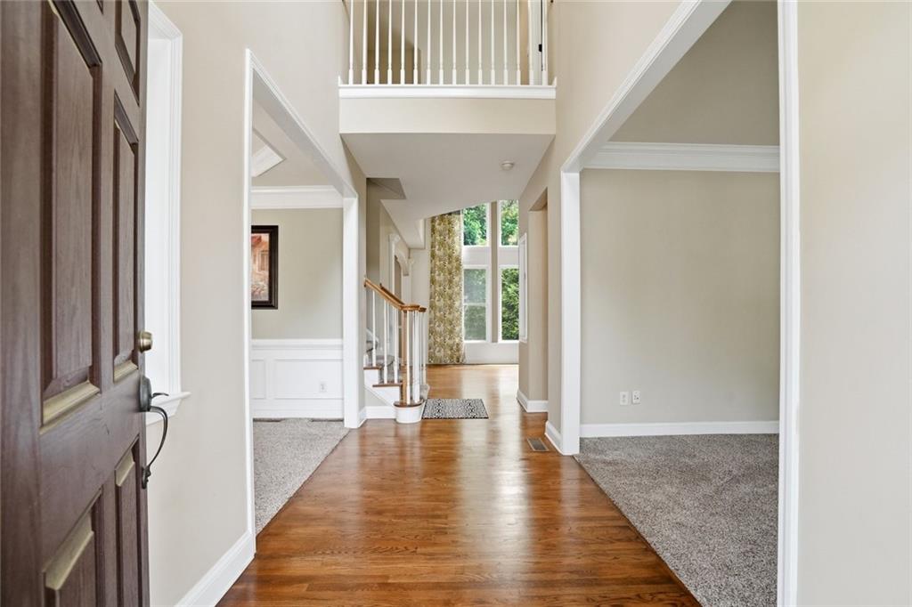 855 Freedom Way Cumming, GA 30040 - Photo 2 of 25 a view of an entryway with wooden floor