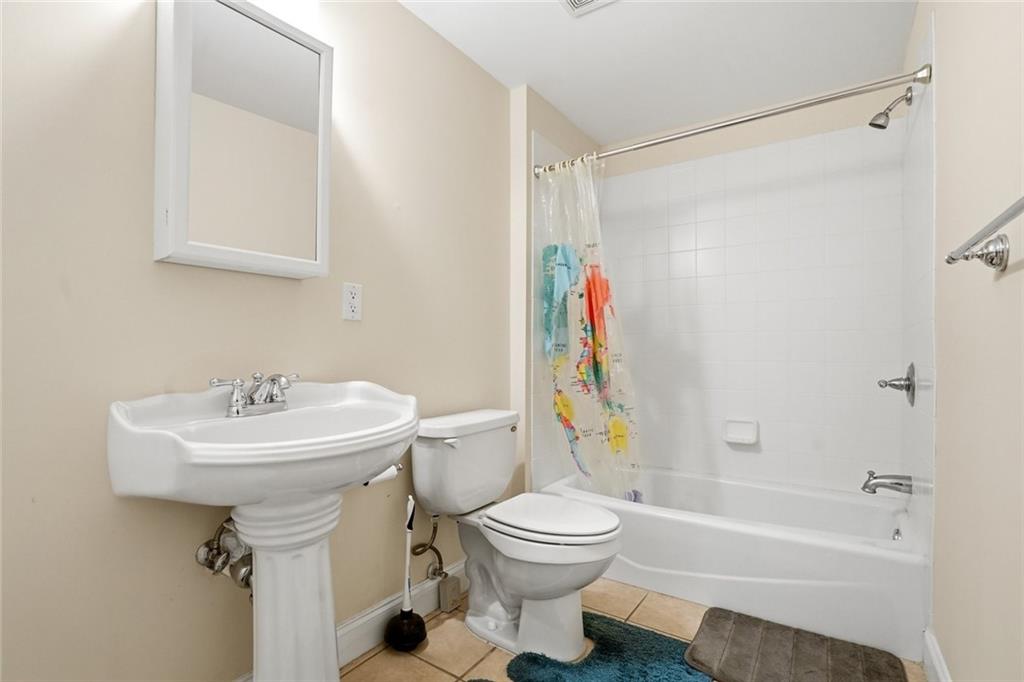 855 Freedom Way Cumming, GA 30040 - Photo 21 of 25 a bathroom with a sink toilet and shower