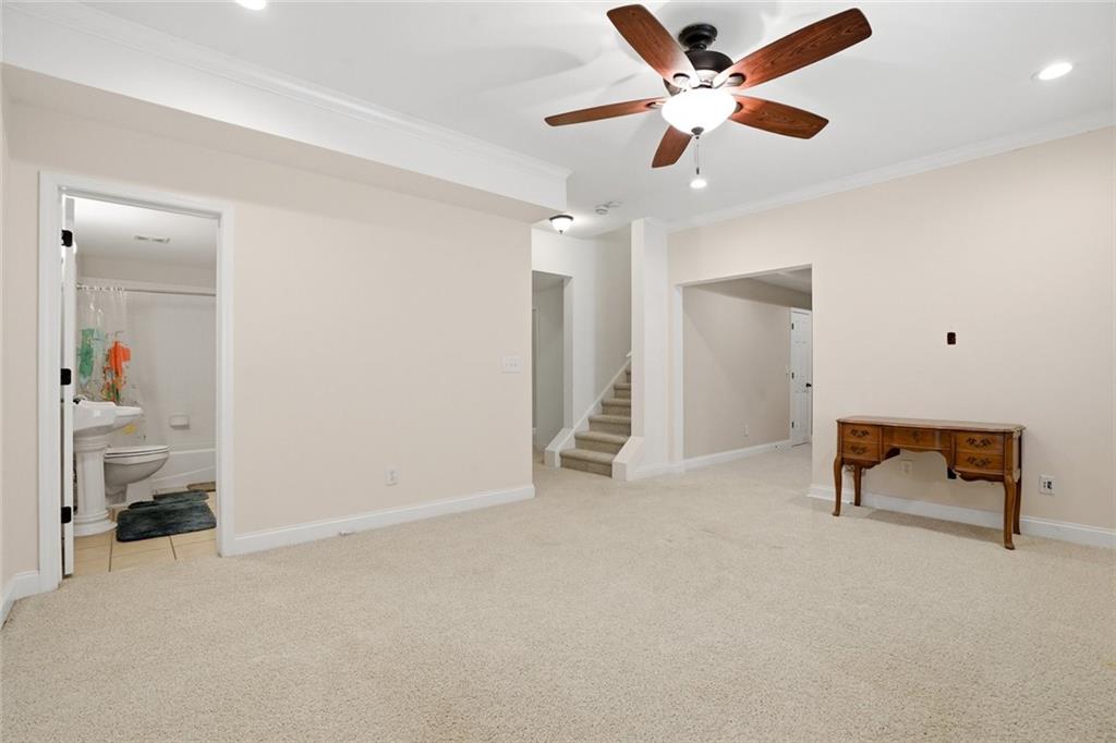 855 Freedom Way Cumming, GA 30040 - Photo 22 of 25 a living room with furniture and a ceiling fan
