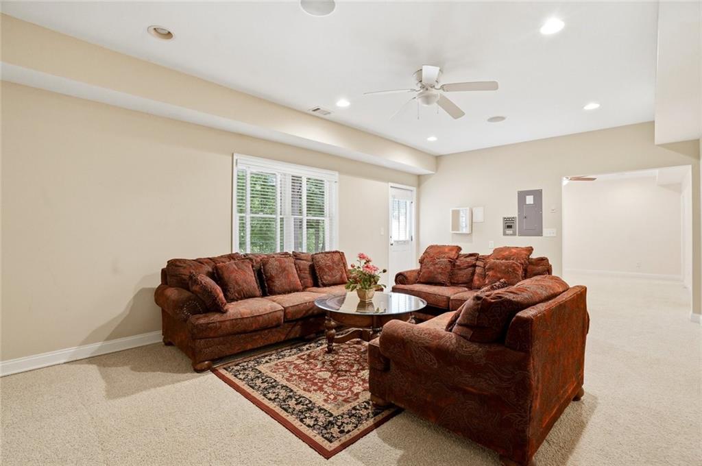 855 Freedom Way Cumming, GA 30040 - Photo 23 of 25 a living room with furniture and a window