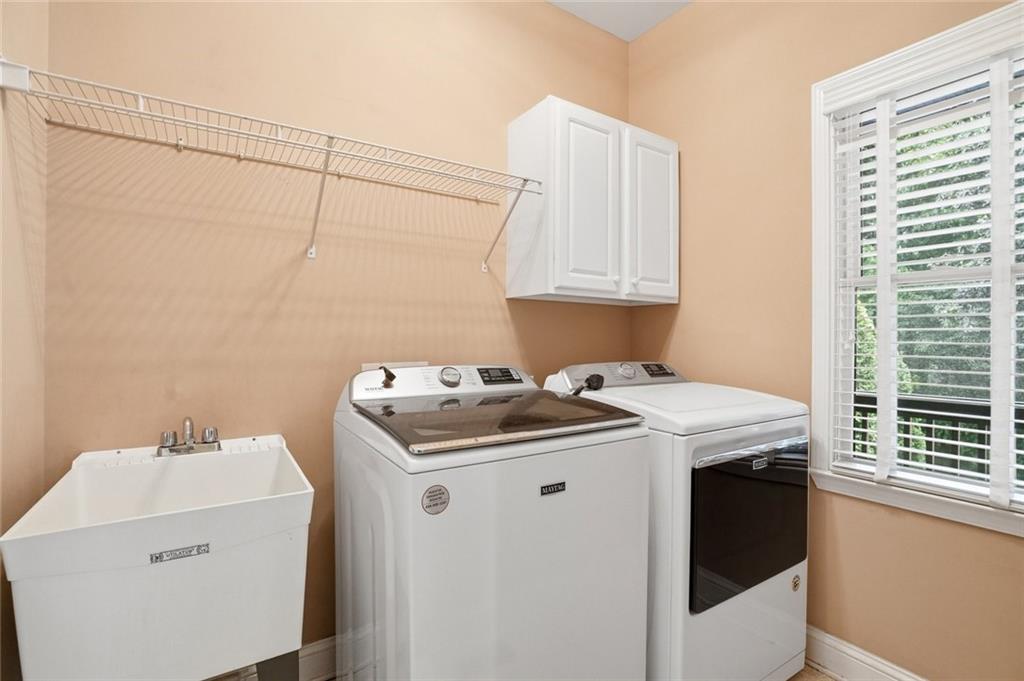 855 Freedom Way Cumming, GA 30040 - Photo 24 of 25 a utility room with dryer and washer