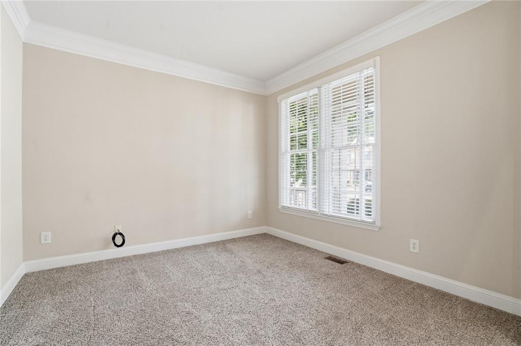 855 Freedom Way Cumming, GA 30040 - Photo 3 of 25 an empty room with a window
