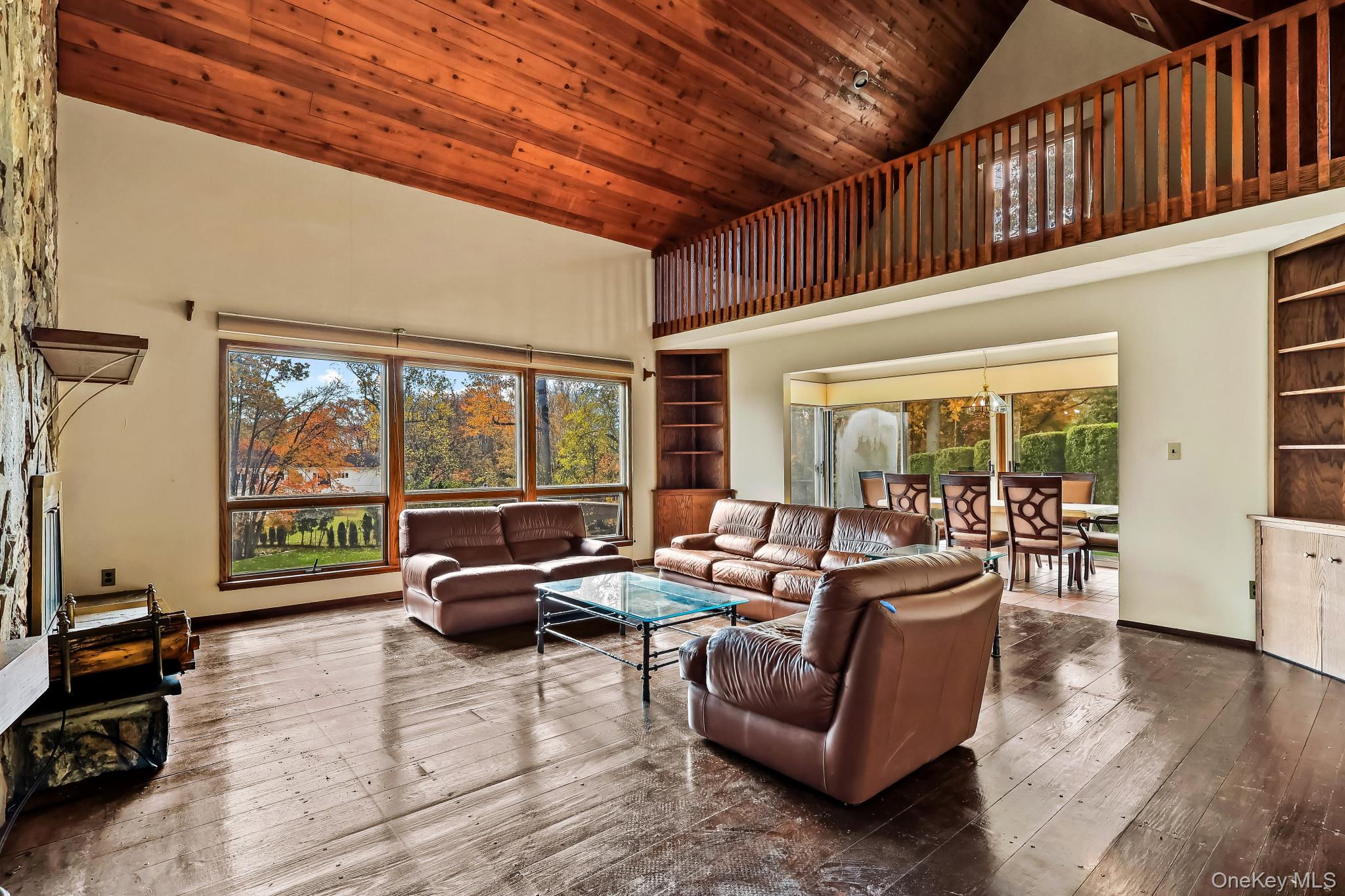 37 Century Trail Harrison, NY 10528 - Photo 11 of 43 Family room with high vaulted ceiling, hardwood / wood-style flooring, and wooden ceiling
