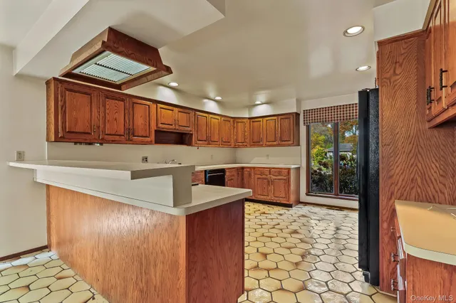 a view of a hallway with entryway and front door