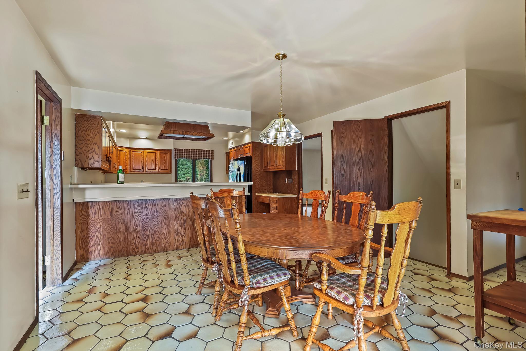 37 Century Trail Harrison, NY 10528 - Photo 16 of 43 Dining area with baseboards and a chandelier