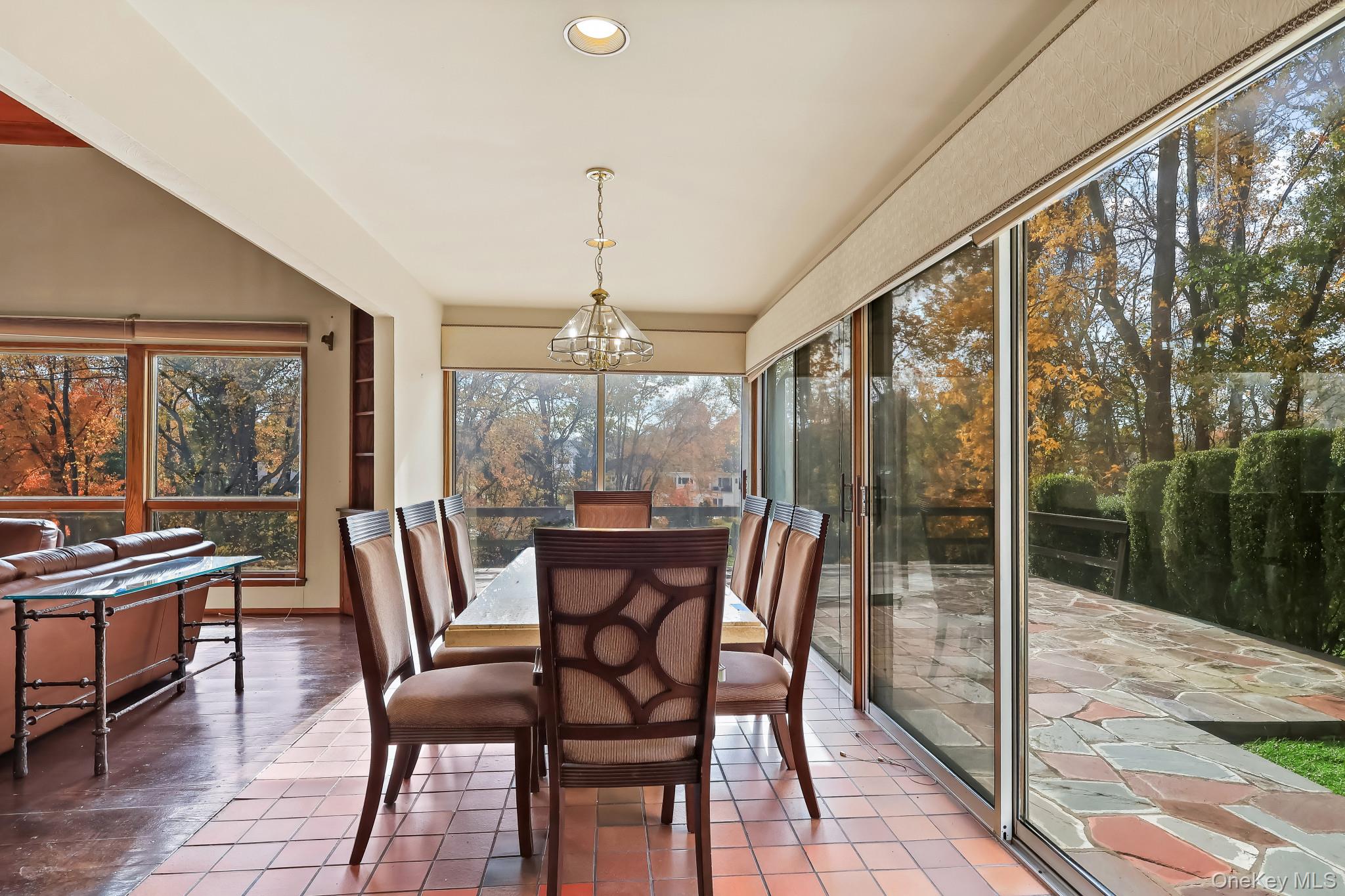 37 Century Trail Harrison, NY 10528 - Photo 17 of 43 Sunroom featuring tile patterned floors, a chandelier, and recessed lighting