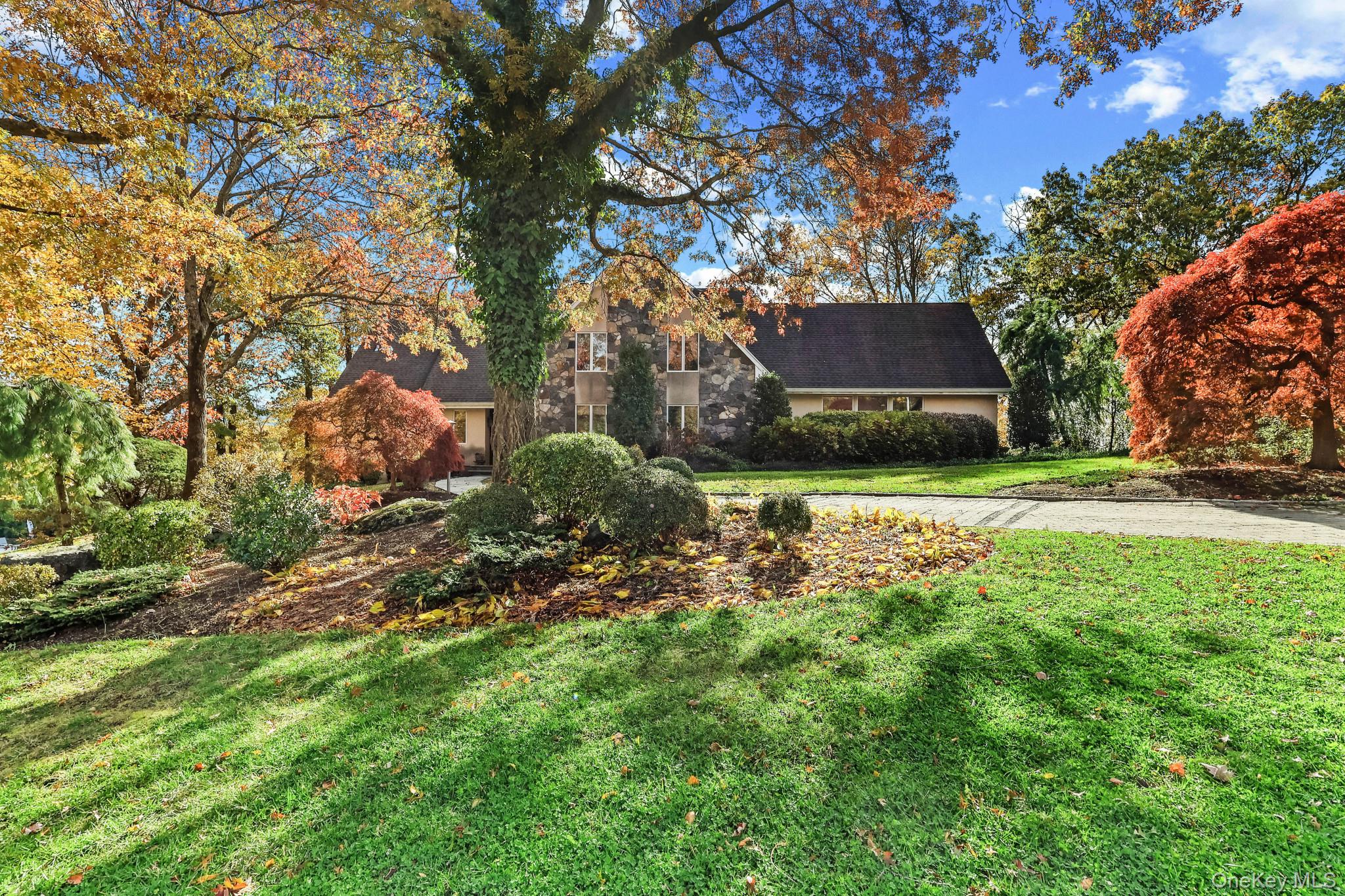 37 Century Trail Harrison, NY 10528 - Photo 2 of 43 View of front of house with a front lawn and stucco siding