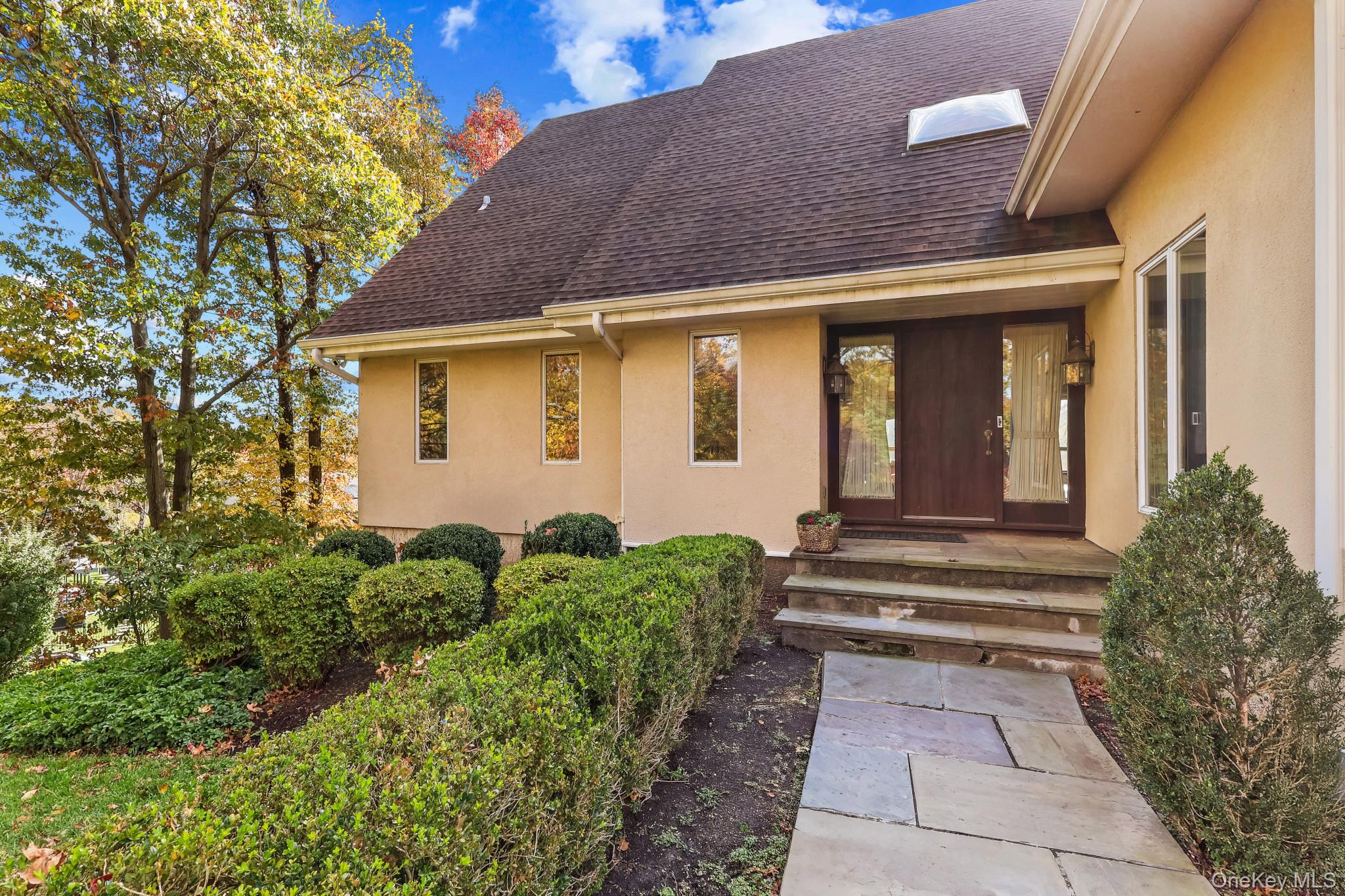 37 Century Trail Harrison, NY 10528 - Photo 4 of 43 Doorway to property with a shingled roof and stucco siding