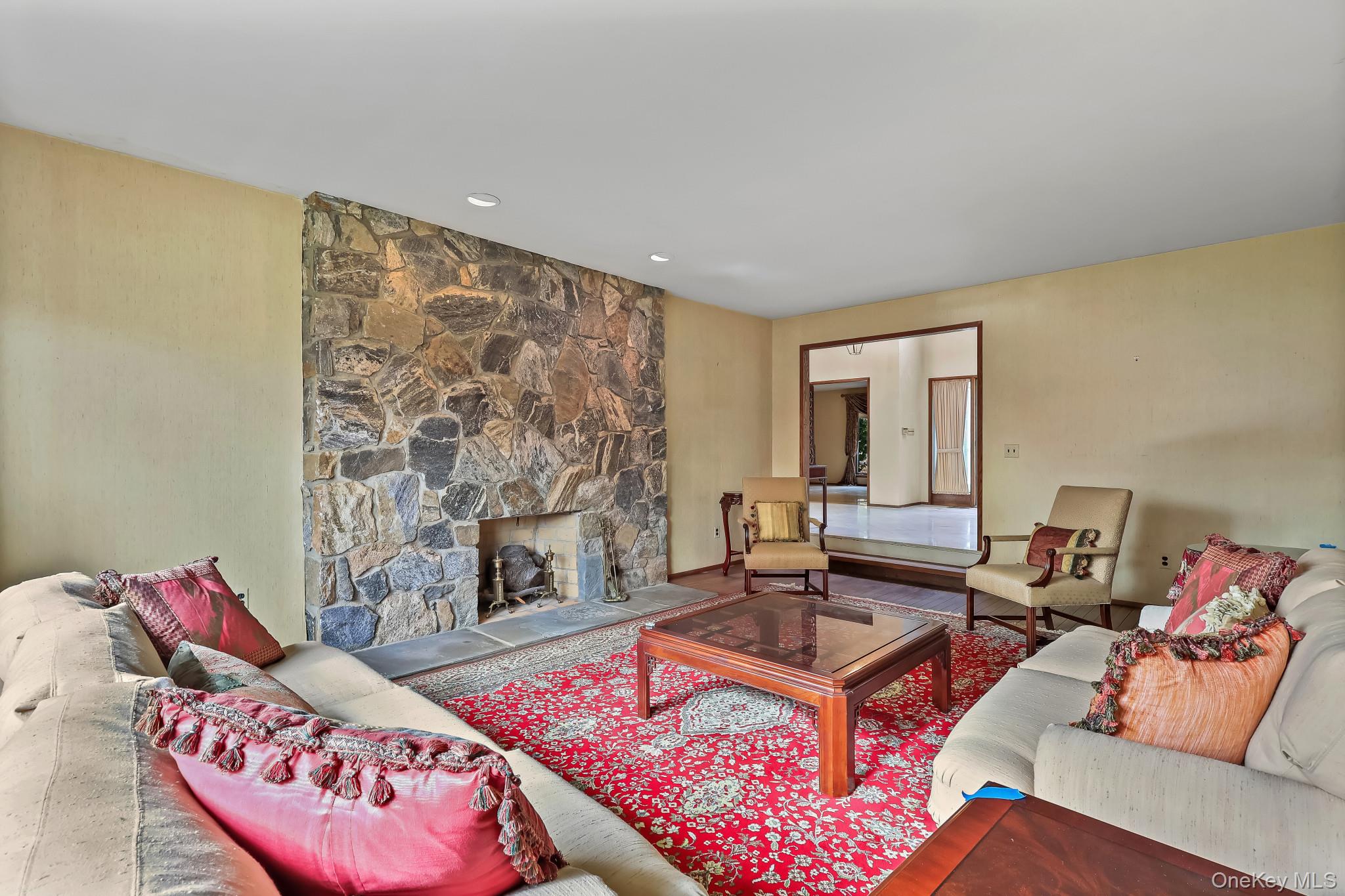 37 Century Trail Harrison, NY 10528 - Photo 8 of 43 Living room featuring a wood burning stone fireplace
