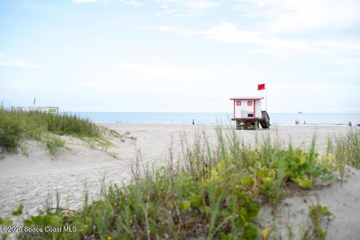 801 South Brevard Avenue, Unit K Cocoa Beach, FL 32931 - Photo 12 of 14 a terrace with a view of trees