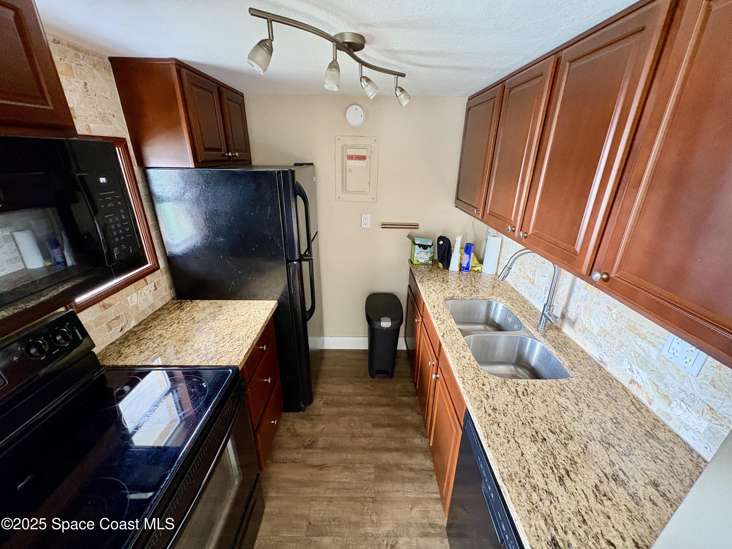 801 South Brevard Avenue, Unit K Cocoa Beach, FL 32931 - Photo 2 of 14 a living room with furniture and a fireplace