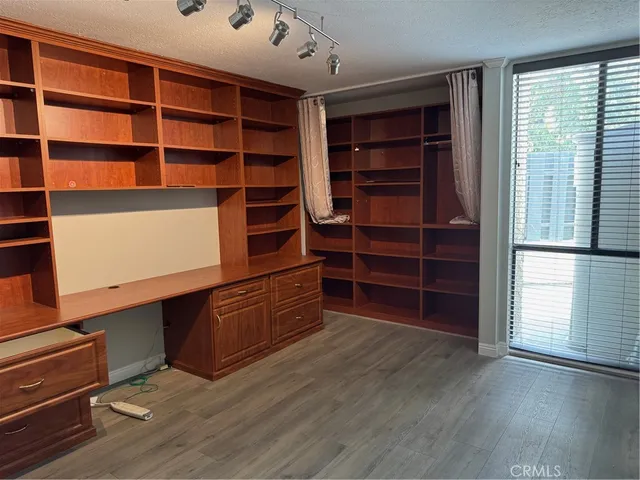 a room with furniture and wooden floor