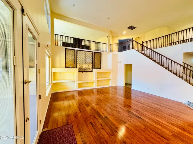 a view of hallway with wooden floor