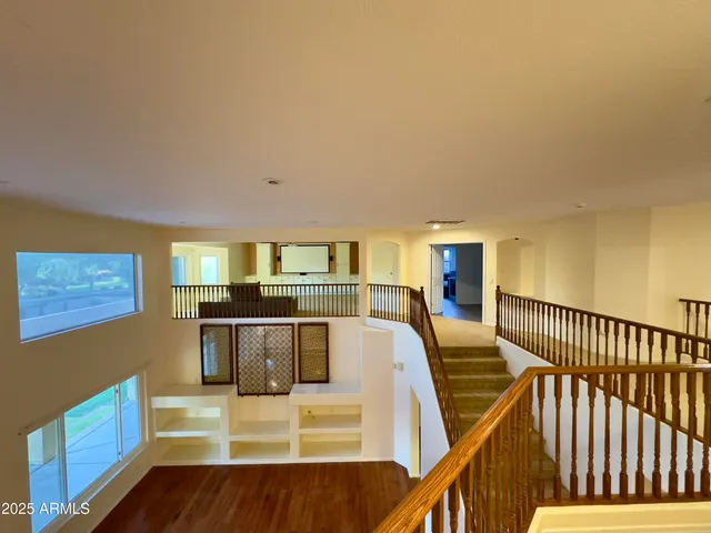 a view of a living room with furniture and kitchen view