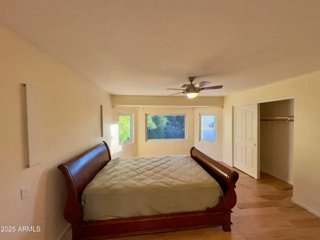 a bedroom with a bed and window