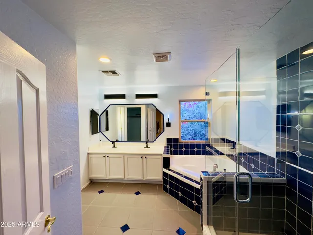 a kitchen with stainless steel appliances a stove a sink and a refrigerator