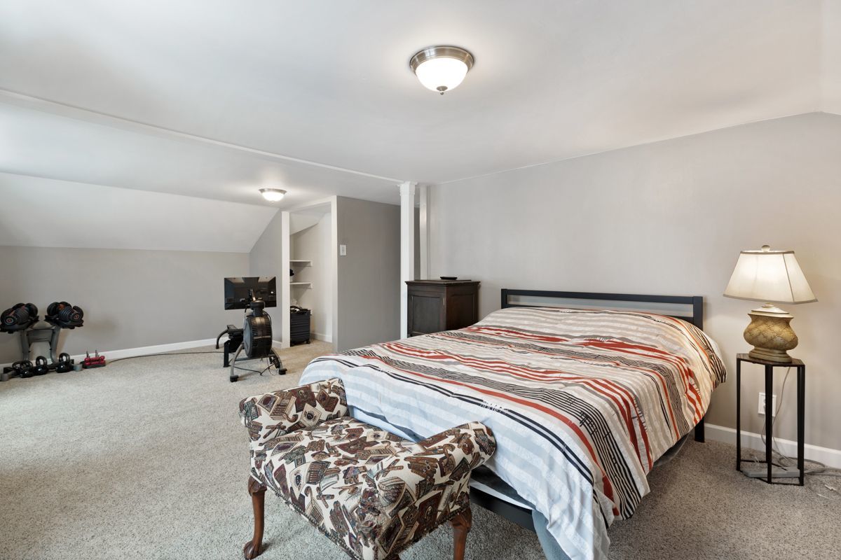 10N849 Rippburger Road Elgin, IL 60124 - Photo 18 of 36 a bedroom with a bed and a couch