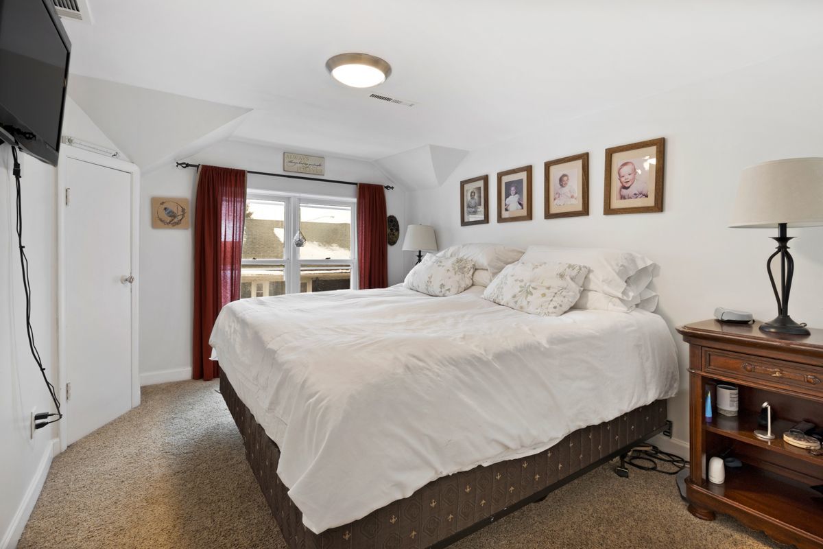10N849 Rippburger Road Elgin, IL 60124 - Photo 21 of 36 a bedroom with a bed and a flat tv screen on the dresser