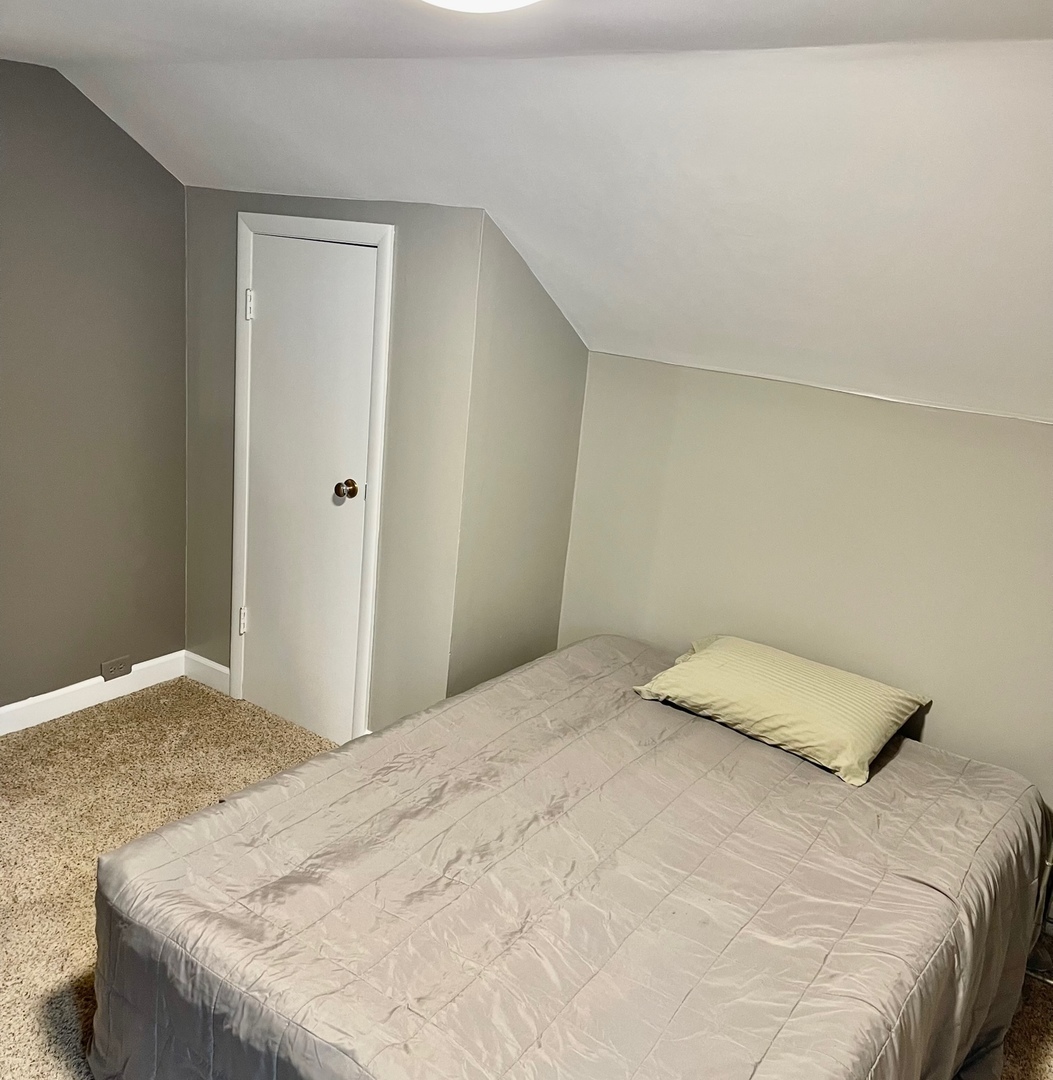 10N849 Rippburger Road Elgin, IL 60124 - Photo 22 of 36 a bedroom with a bed and a window