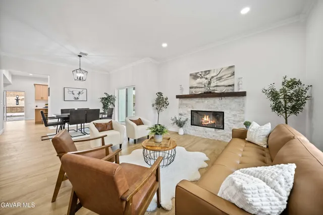 a view of a workspace with furniture and a potted plant