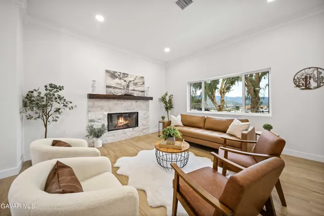 a kitchen with a sink a counter top space stainless steel appliances and cabinets