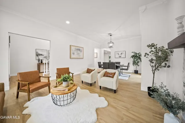 a kitchen with stainless steel appliances kitchen island granite countertop a sink and cabinets