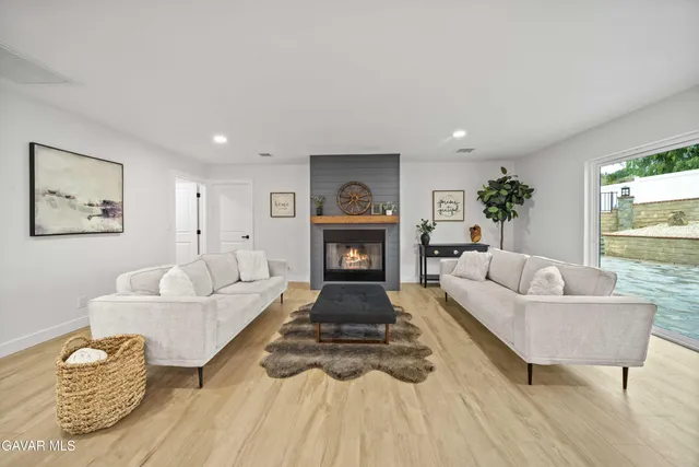 a en suite bathroom with a double vanity sink and a mirror