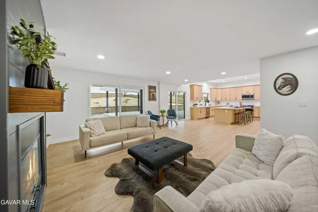 a bedroom with a large bed and a couch