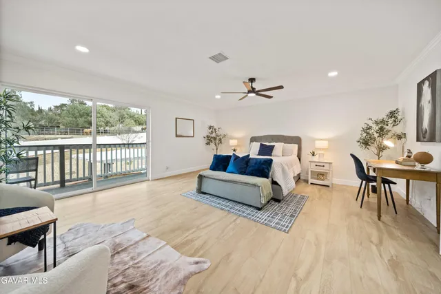 a bathroom with a granite countertop sink a toilet a shower and a mirror