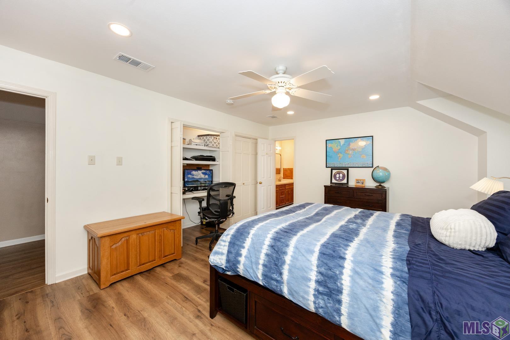 317 West Woodstone Court Baton Rouge, LA 70808 - Photo 32 of 48 Upstairs Bedroom with Additional Closet Turned into Desk/Gaming Space