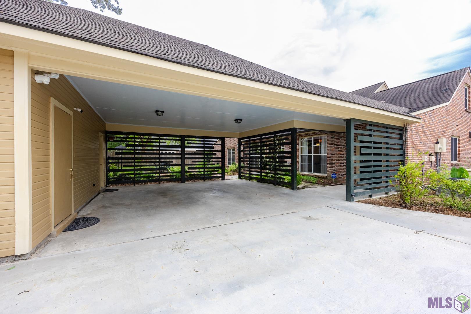 317 West Woodstone Court Baton Rouge, LA 70808 - Photo 43 of 48 Carport with Workshop and Half Bath