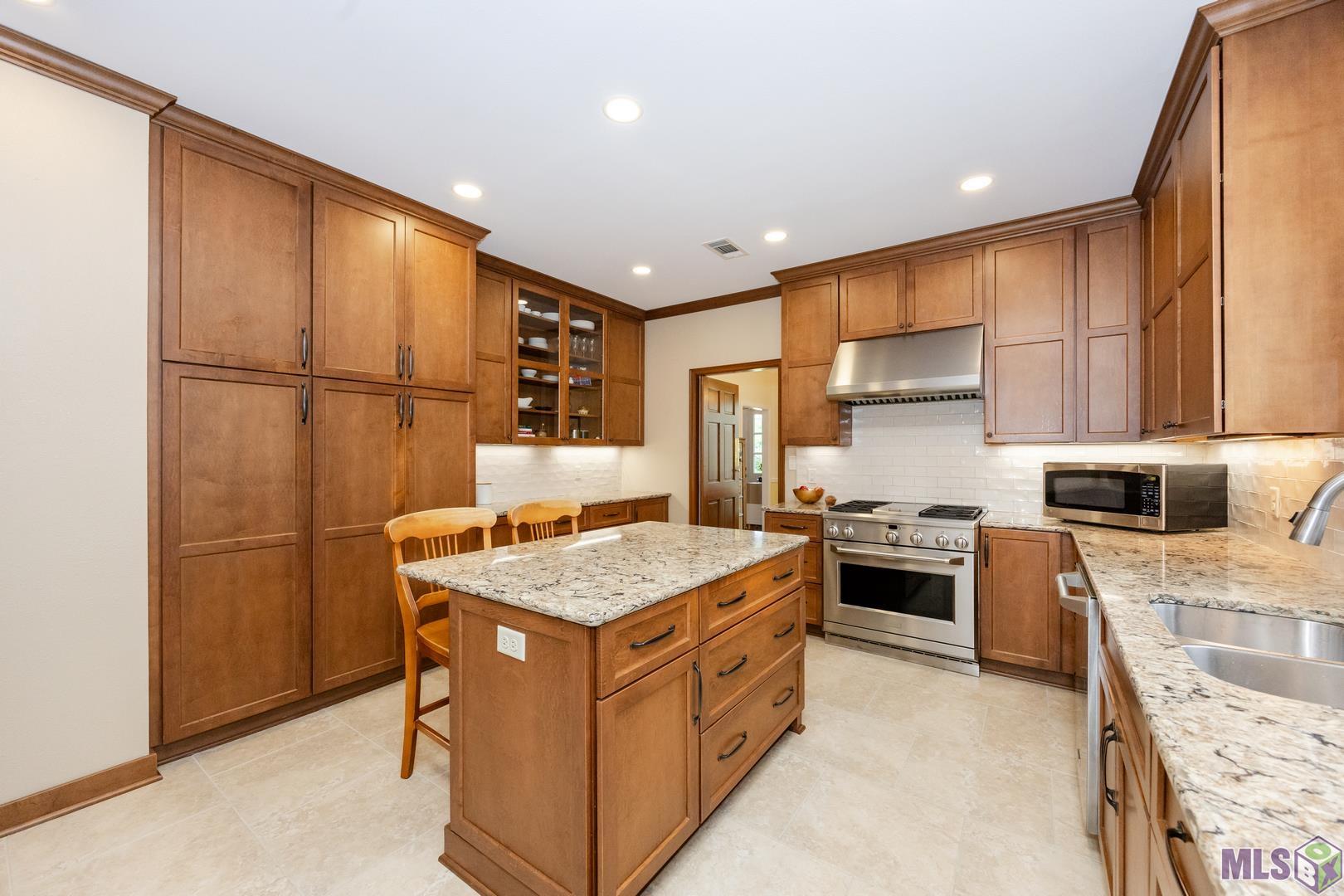 317 West Woodstone Court Baton Rouge, LA 70808 - Photo 9 of 48 Great Cabinet Storage including the Island