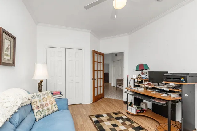 a bedroom with furniture and a wooden floor