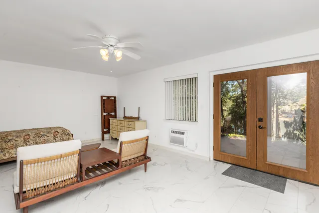 a bedroom with furniture and a window