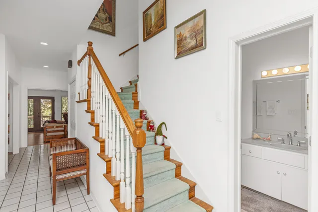 a view of entryway and hall with a sink