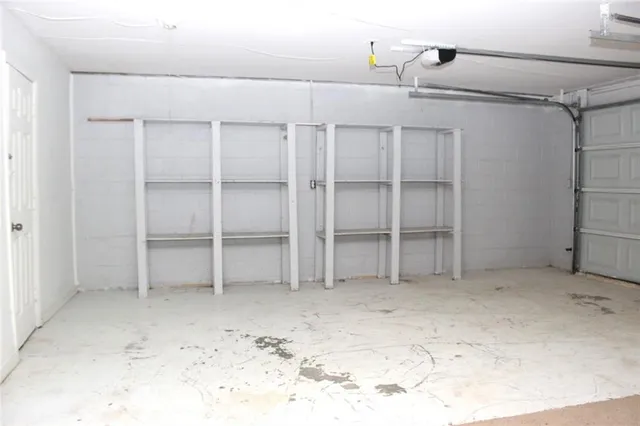 a view of a room with shelf on the wall