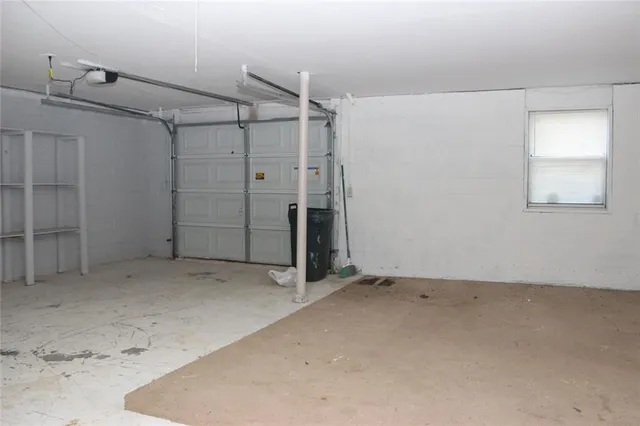 an empty room with a wooden door