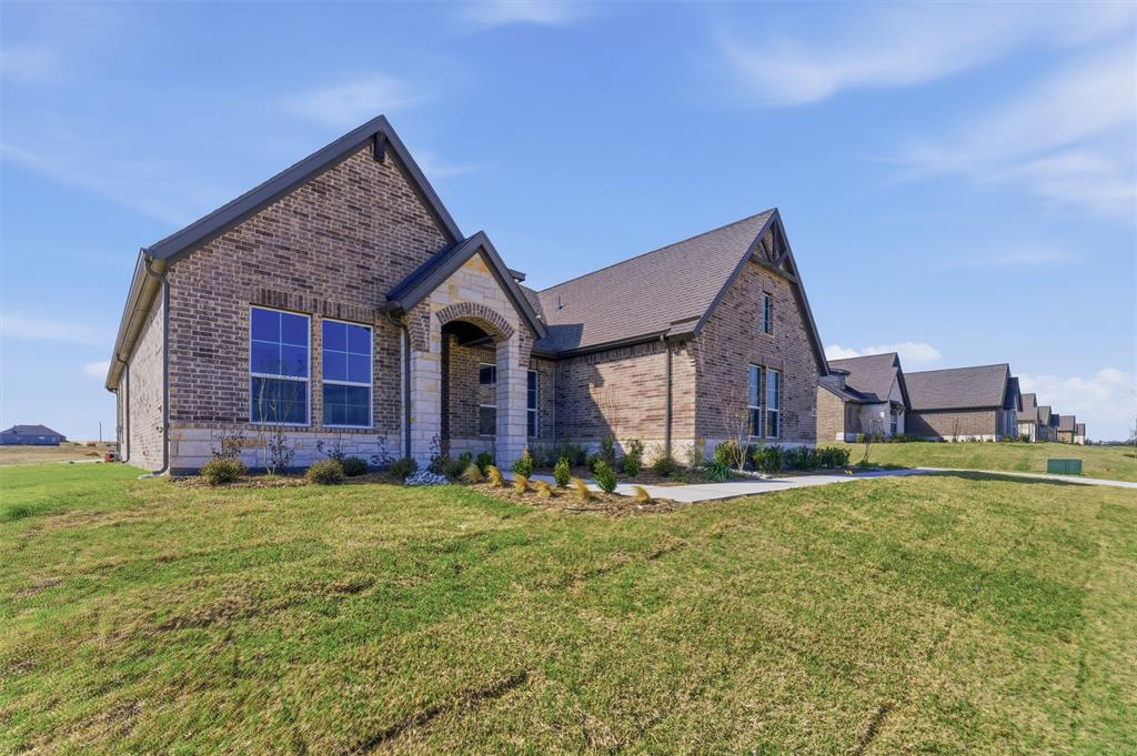 814 Vly Rdg Road Van Alstyne, TX 75495 - Photo 4 of 24 a view of a house with a yard